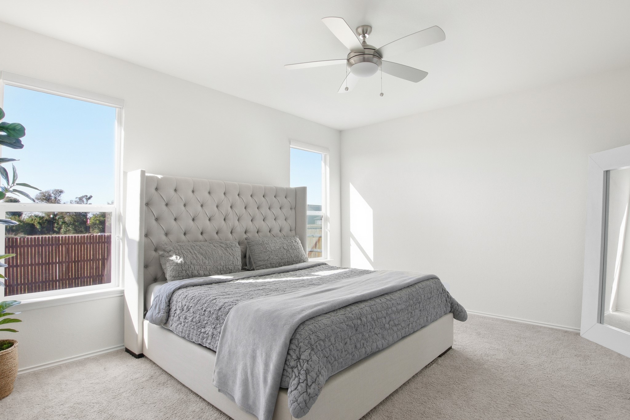 102 Whitney Drive Elgin, TX 78621 - Photo 12 of 24 a bedroom with a large bed and a window