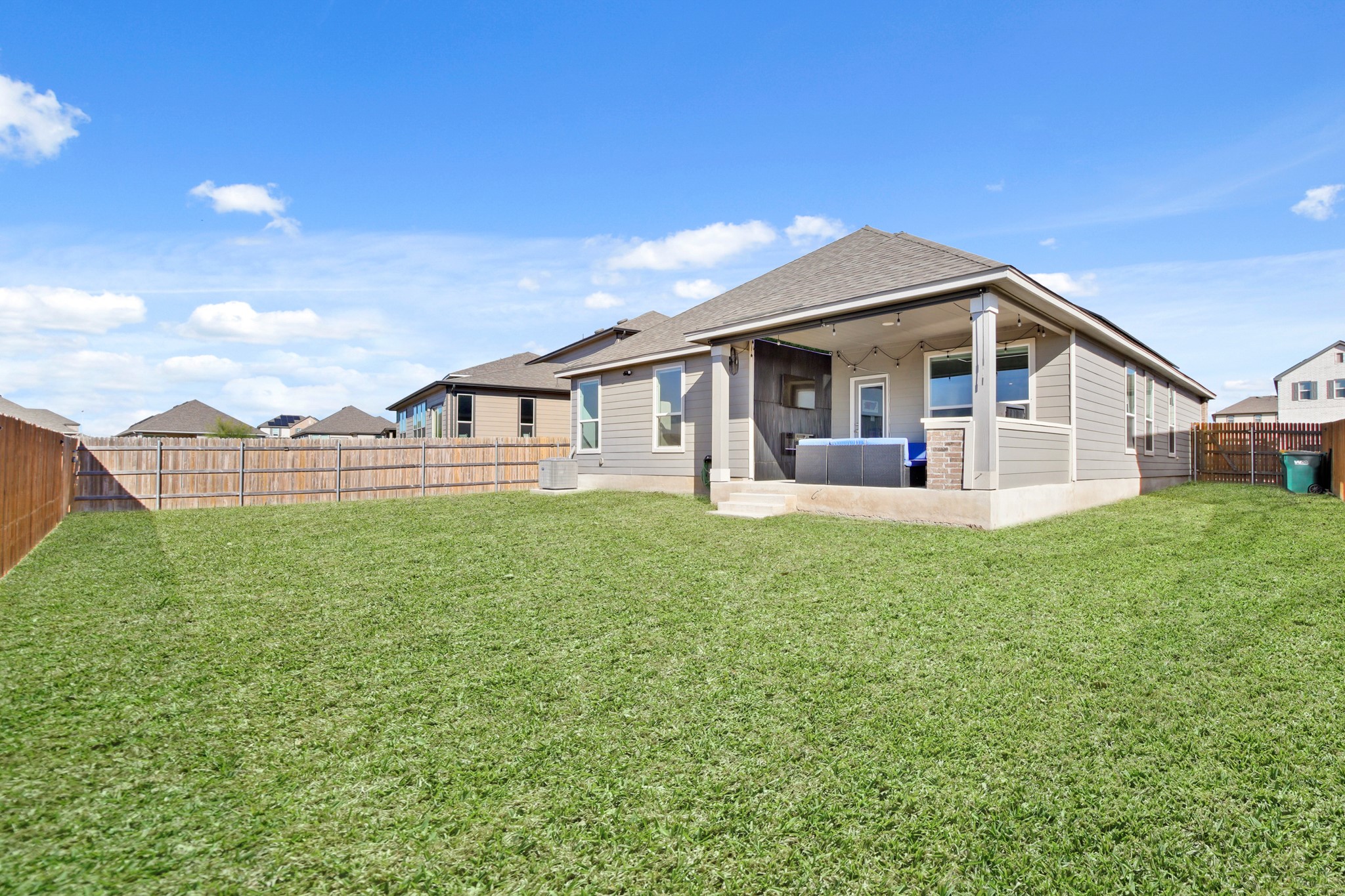 102 Whitney Drive Elgin, TX 78621 - Photo 22 of 24 a view of a house with a backyard