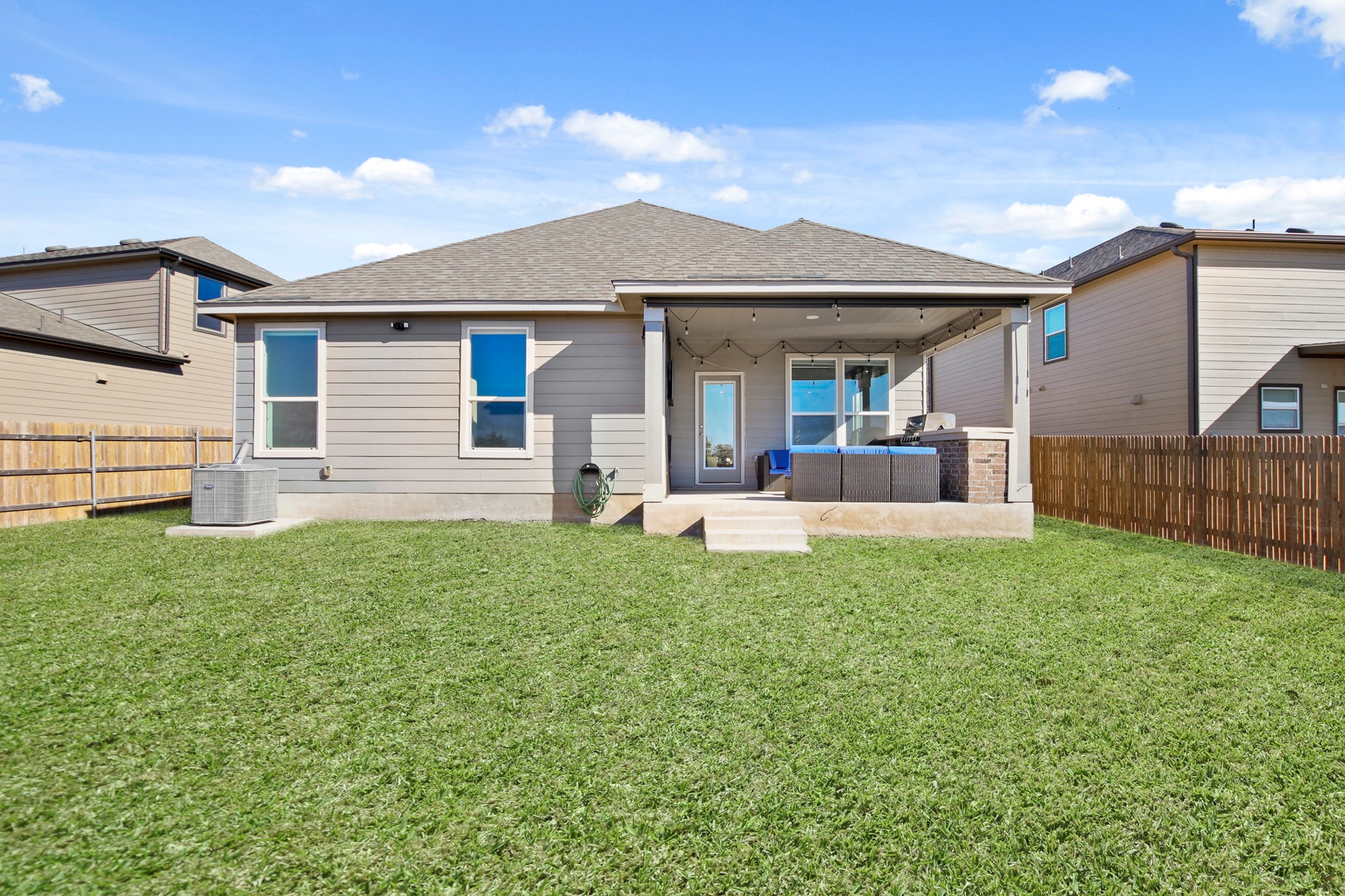 102 Whitney Drive Elgin, TX 78621 - Photo 23 of 24 a view of a house with backyard and porch