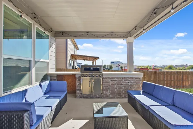 a view of balcony with couch and outdoor seating