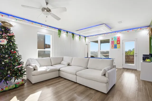 a living room with furniture and a large window