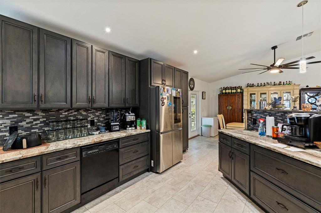 649 16th Street Northwest Largo, FL 33770 - Photo 15 of 42 a kitchen with refrigerator and cabinets