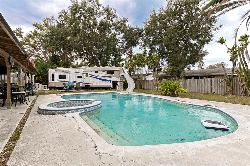 649 16th Street Northwest Largo, FL 33770 - Photo 29 of 42 a view of a swimming pool with a patio