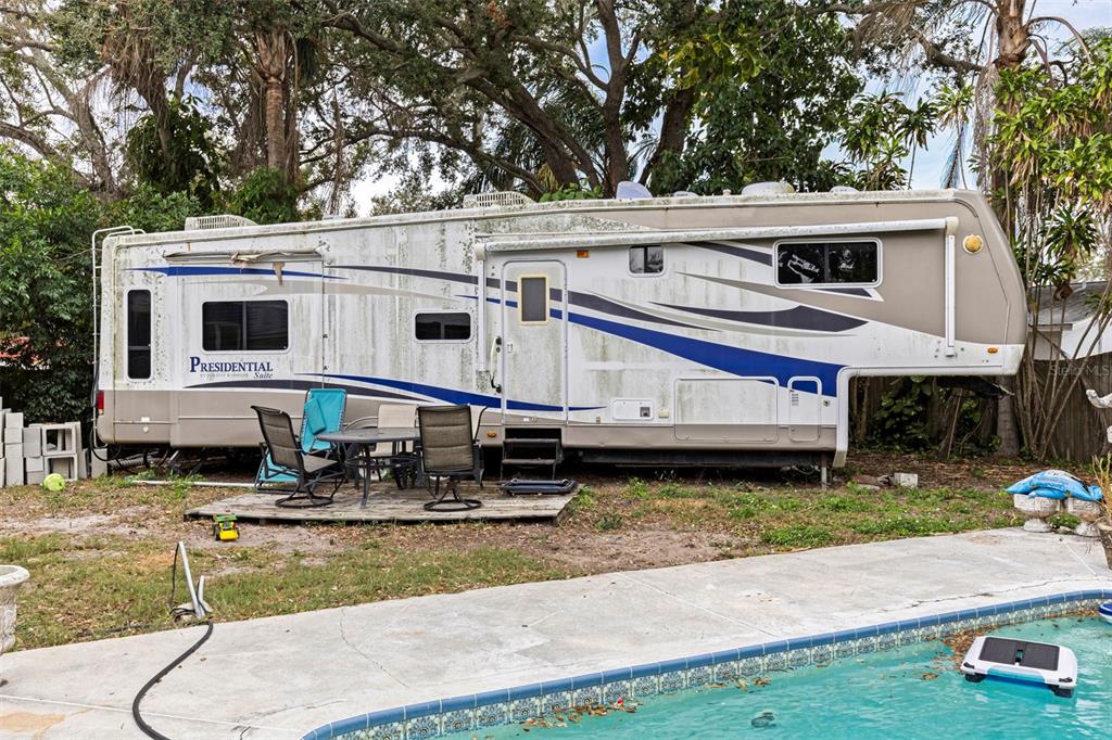 649 16th Street Northwest Largo, FL 33770 - Photo 32 of 42 a view of a house with backyard and sitting area
