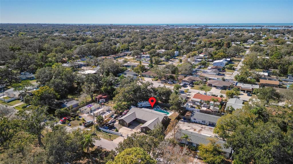 649 16th Street Northwest Largo, FL 33770 - Photo 35 of 42 an aerial view of residential house with parking and yard