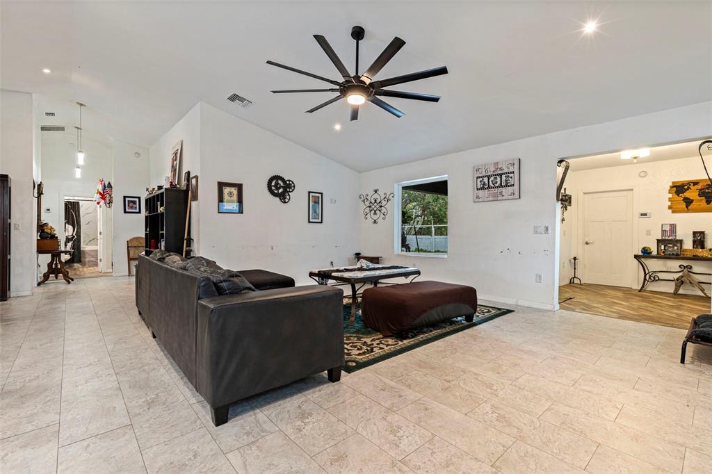 649 16th Street Northwest Largo, FL 33770 - Photo 8 of 42 a living room with furniture and a large window