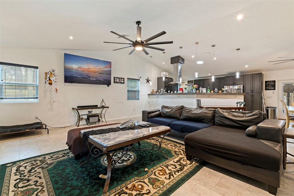 649 16th Street Northwest Largo, FL 33770 - Photo 10 of 42 a living room with furniture and a flat screen tv
