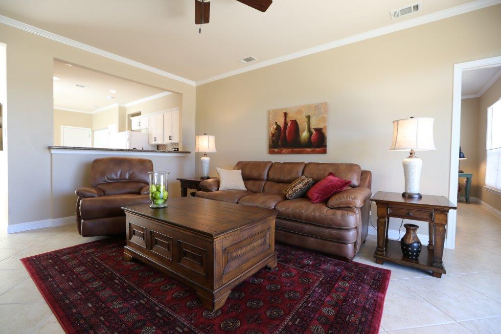 109 Ranier Lane Georgetown, TX 78633 - Photo 7 of 18 An inviting common area, perfect for entertaining, offers seamless flow between living and kitchen spaces.