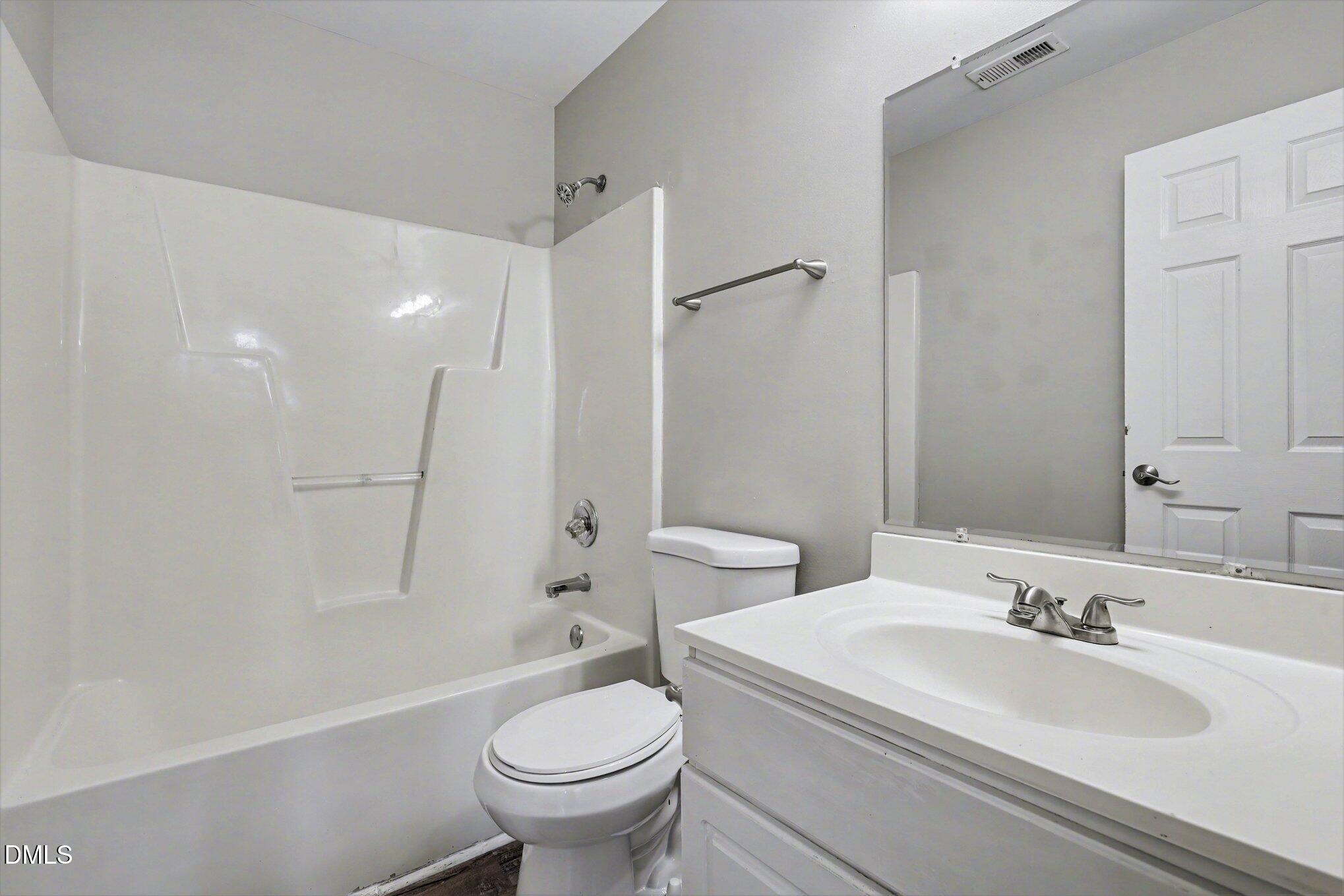 4816 Windbreak Lane Raleigh, NC 27616 - Photo 13 of 17 a bathroom with a sink toilet and shower