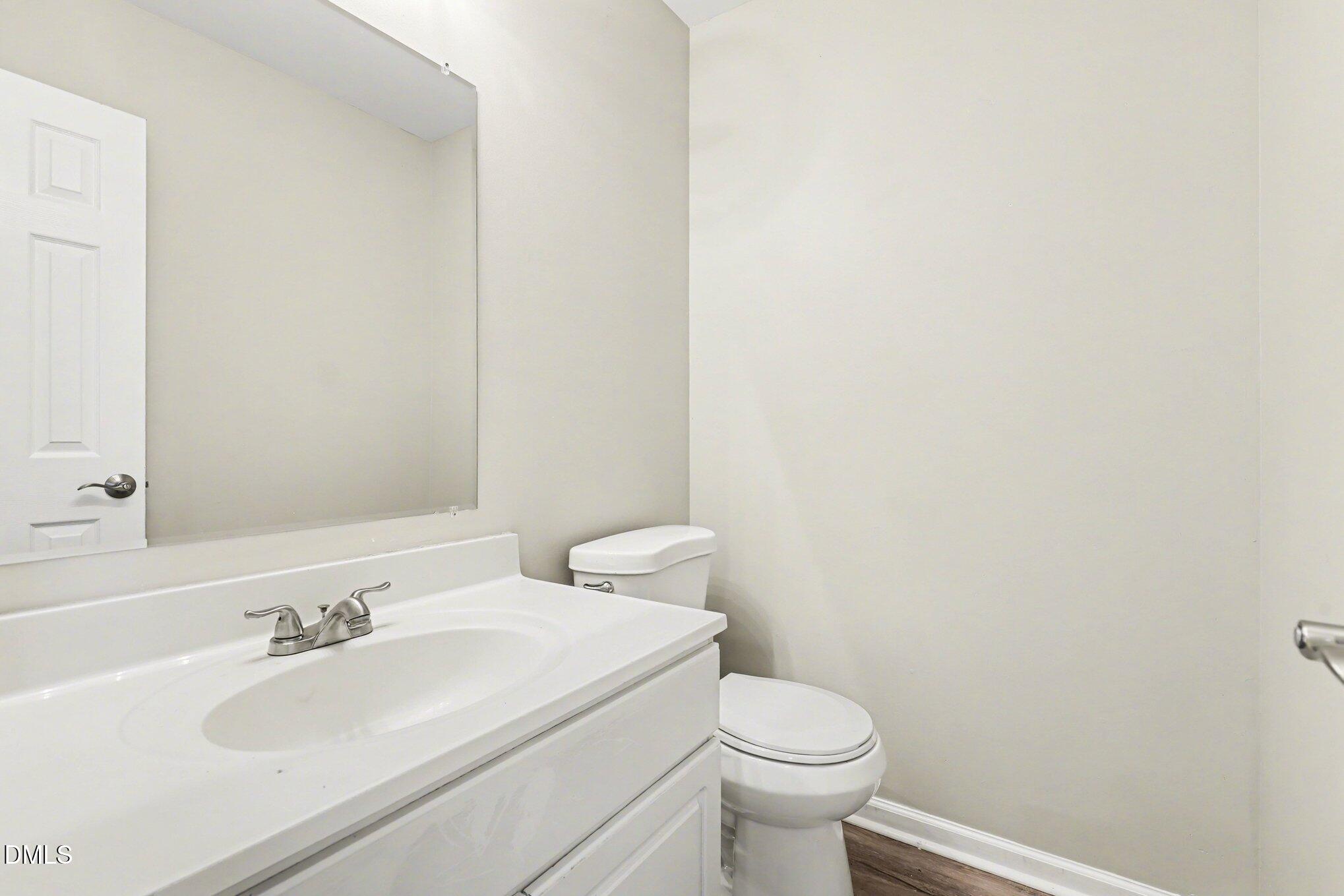4816 Windbreak Lane Raleigh, NC 27616 - Photo 14 of 17 a bathroom with a sink and a toilet