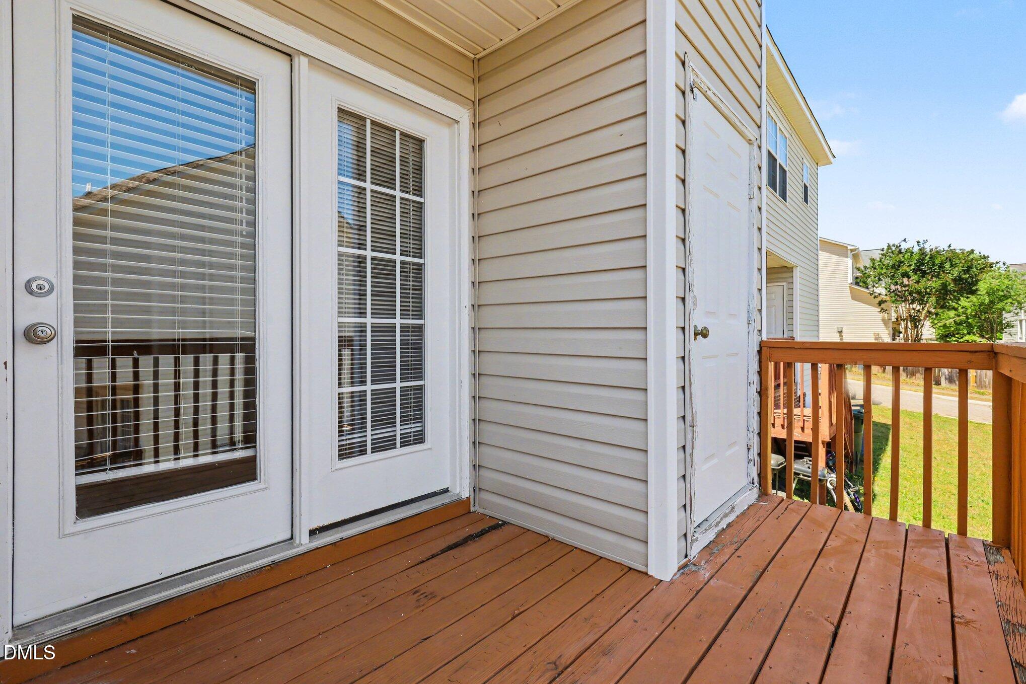 4816 Windbreak Lane Raleigh, NC 27616 - Photo 16 of 17 a view of a balcony with wooden floor