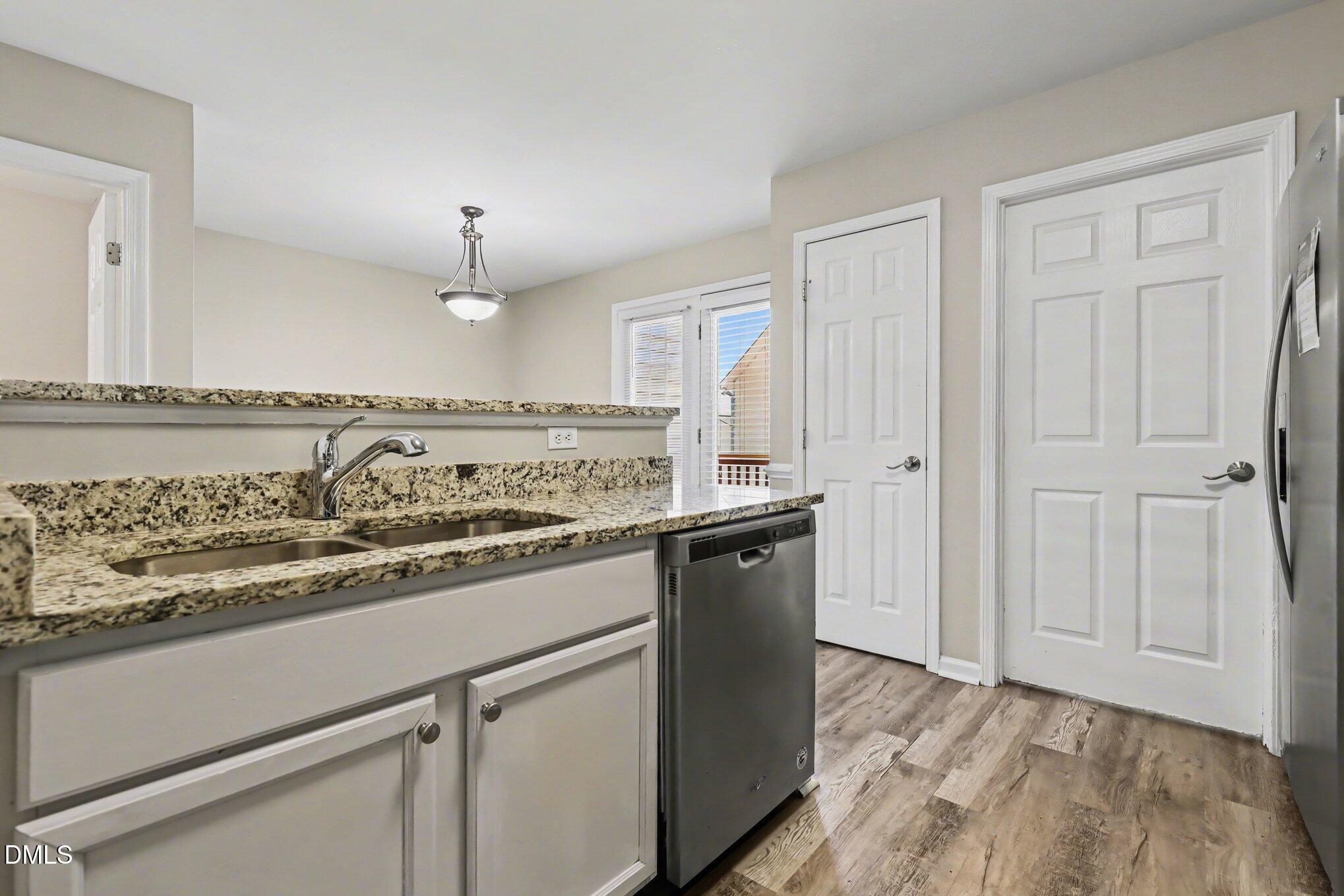 4816 Windbreak Lane Raleigh, NC 27616 - Photo 6 of 17 a view of a kitchen with a sink and dishwasher