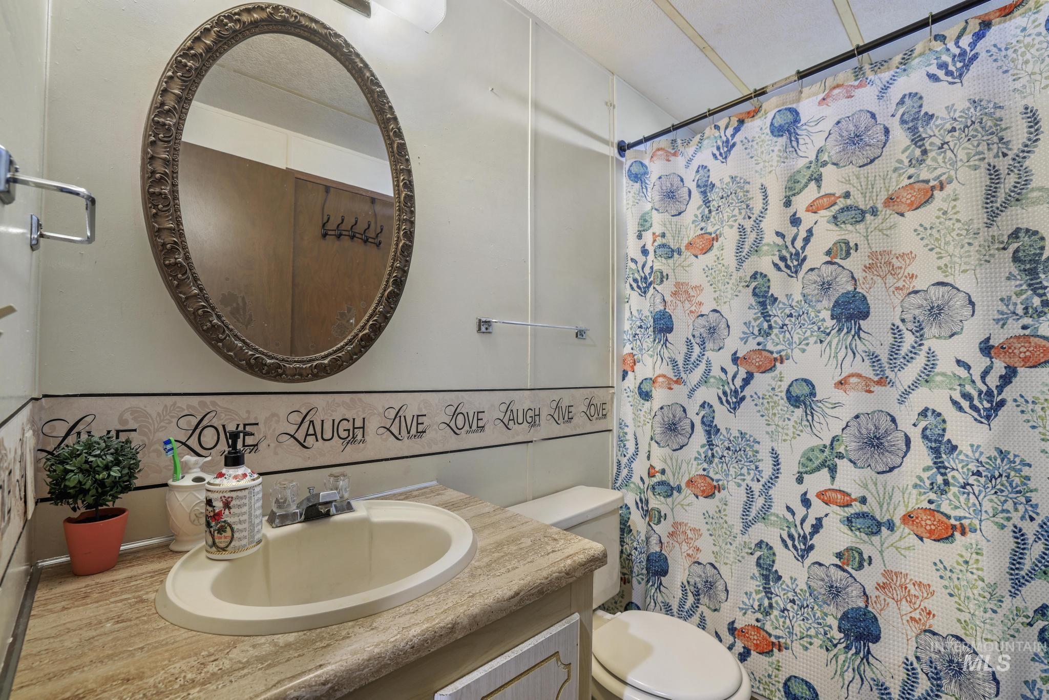 1625 Maple Street, Unit 20 Buhl, ID 83316 - Photo 13 of 17 Full bath featuring vanity and a shower with shower curtain