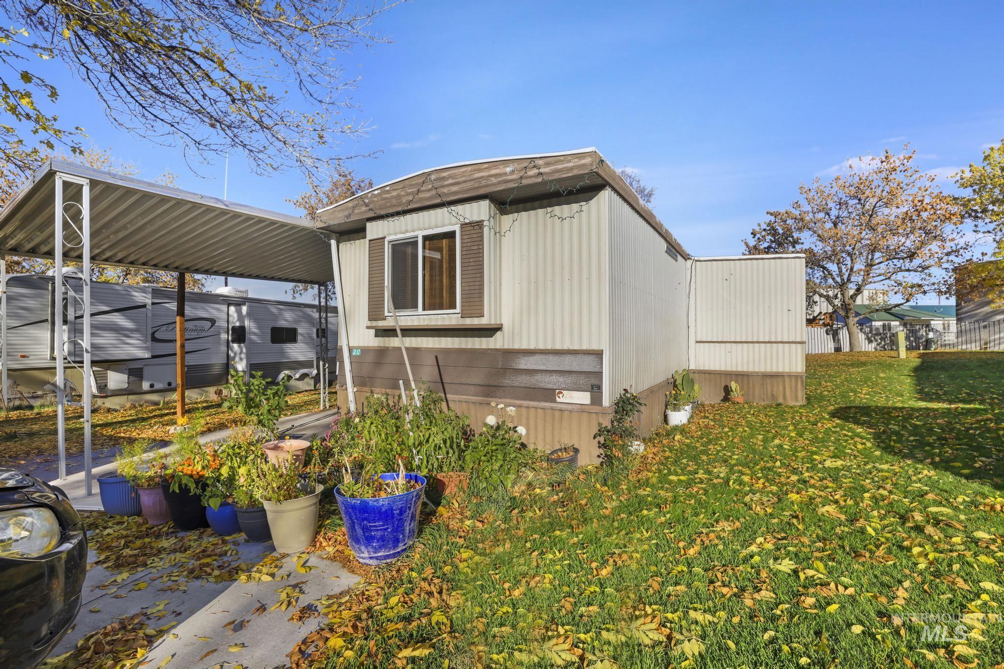 1625 Maple Street, Unit 20 Buhl, ID 83316 - Photo 15 of 17 View of side of home featuring a lawn