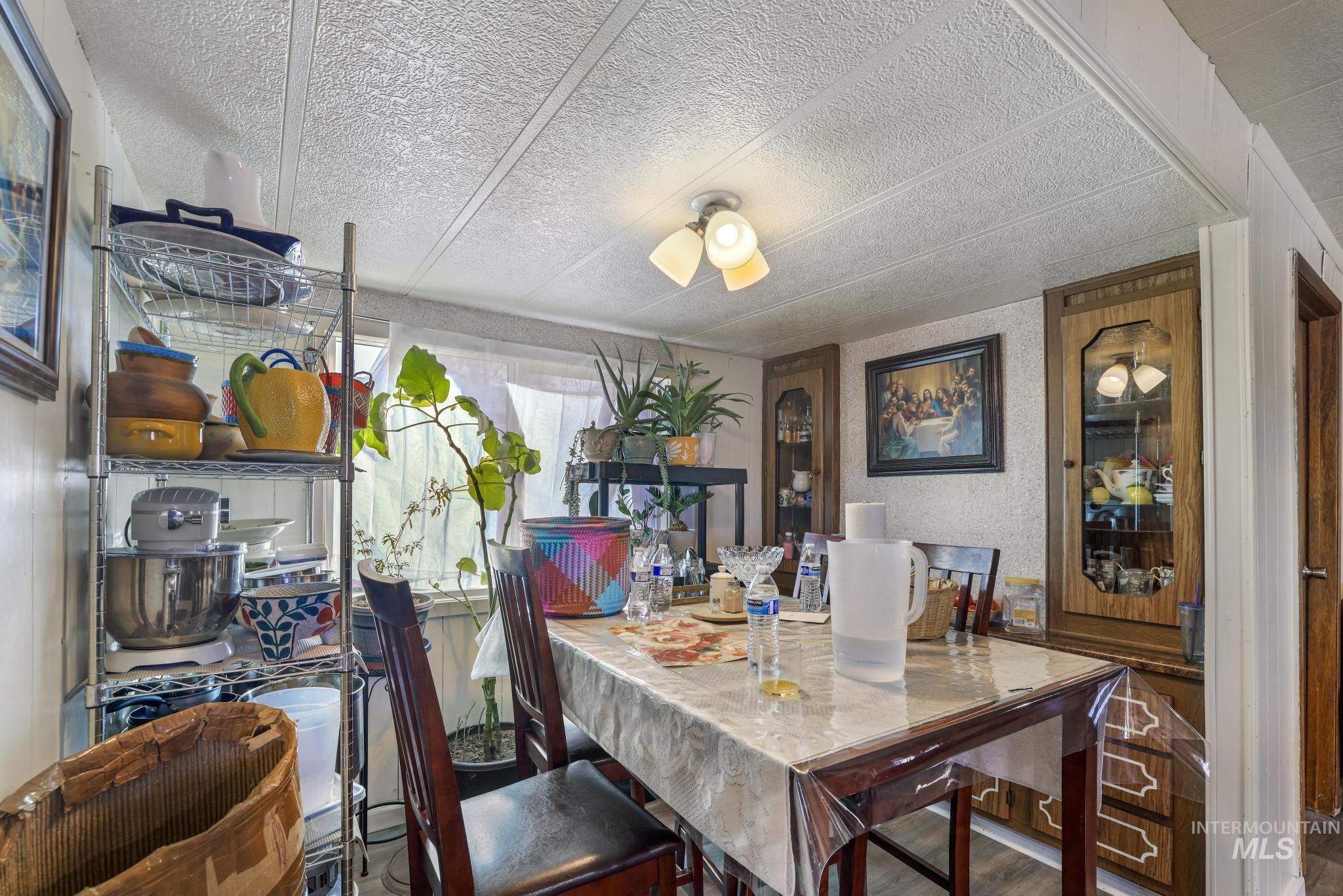 1625 Maple Street, Unit 20 Buhl, ID 83316 - Photo 7 of 17 Dining space featuring wood finished floors and a textured ceiling