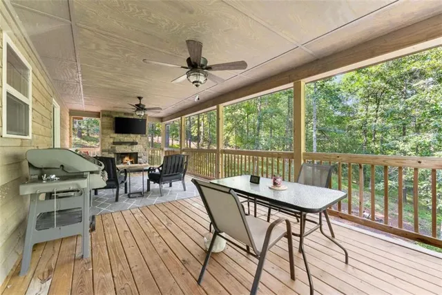a dining room with furniture window and wooden floor