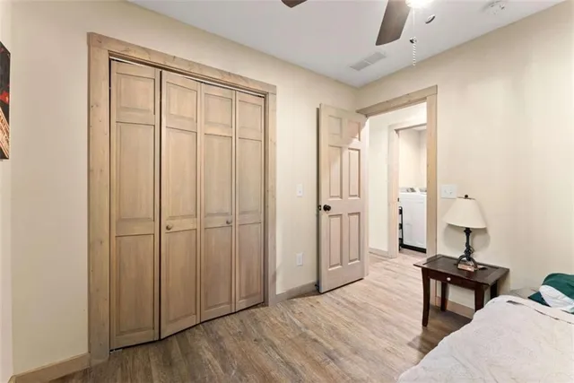 a spacious bedroom with a bed and a table