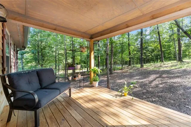 a view of a patio with wooden floor