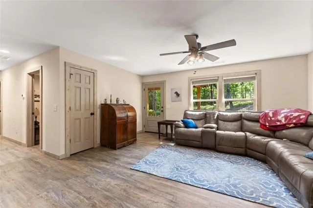a living room with furniture and a window