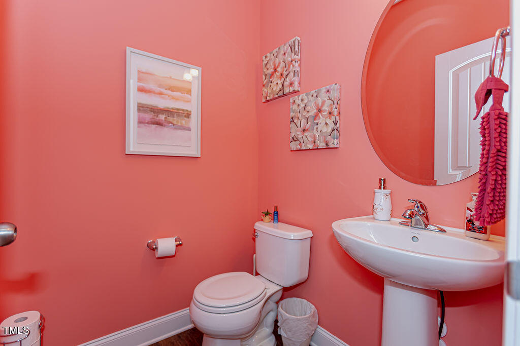 3220 Lacewing Drive Zebulon, NC 27597 - Photo 12 of 69 a bathroom with a toilet and a sink