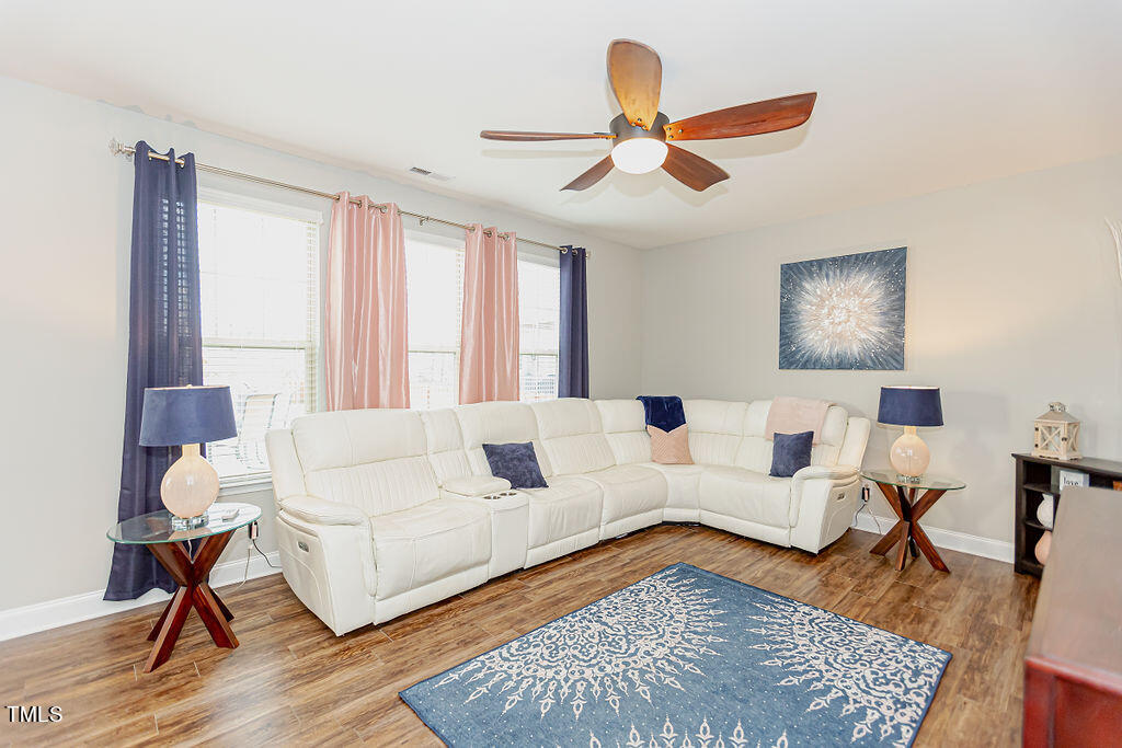 3220 Lacewing Drive Zebulon, NC 27597 - Photo 22 of 69 a living room with furniture and a rug