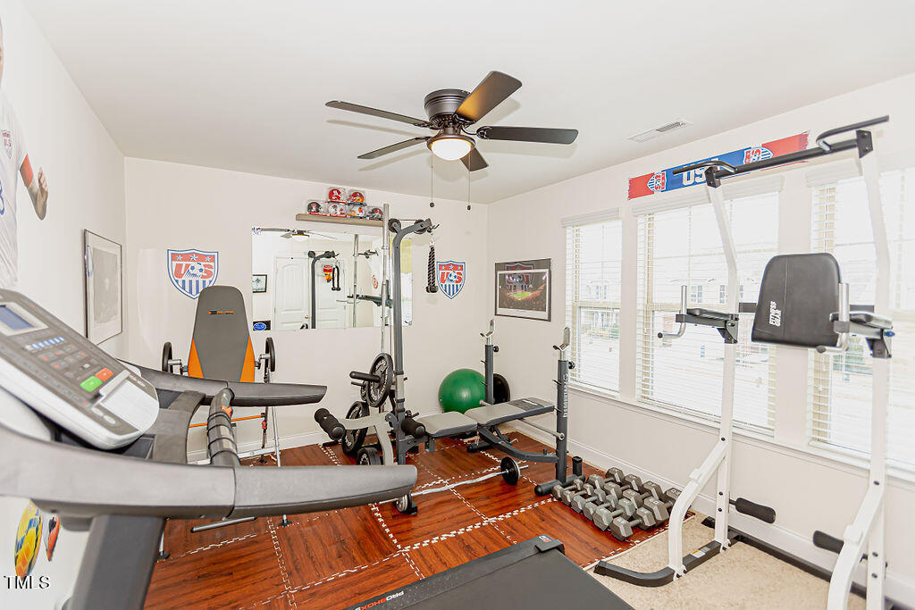 3220 Lacewing Drive Zebulon, NC 27597 - Photo 33 of 69 a living room with furniture and a window