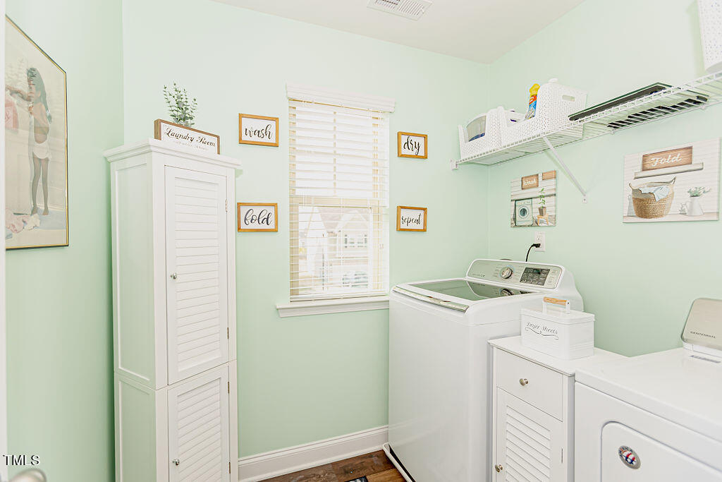 3220 Lacewing Drive Zebulon, NC 27597 - Photo 35 of 69 a utility room with a window dryer and washer