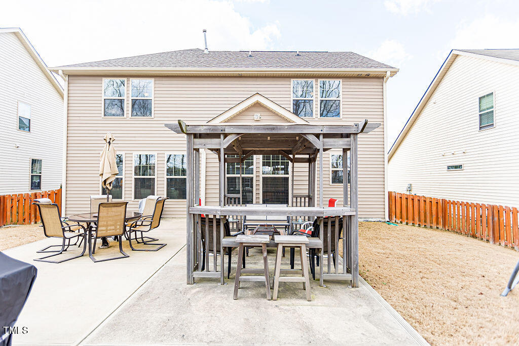 3220 Lacewing Drive Zebulon, NC 27597 - Photo 54 of 69 a view of a house with backyard and porch
