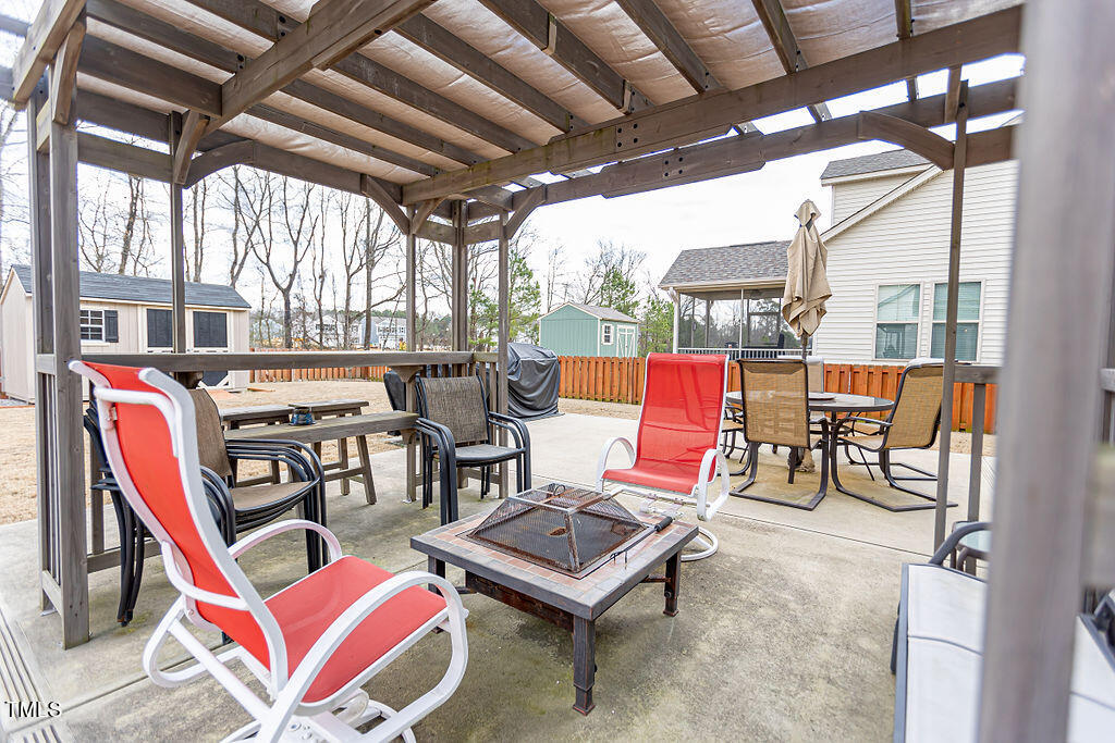 3220 Lacewing Drive Zebulon, NC 27597 - Photo 56 of 69 a building outdoor space with patio furniture and a potted plant