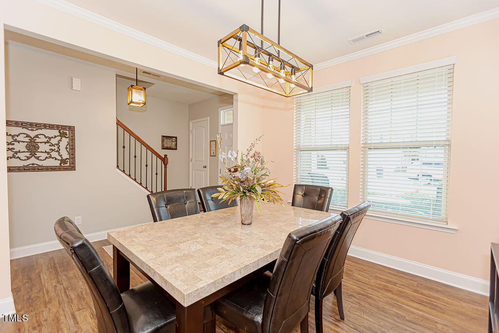 3220 Lacewing Drive Zebulon, NC 27597 - Photo 9 of 69 a view of a dining room with furniture window and wooden floor