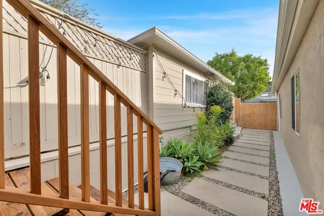 a view of a house with wooden stairs
