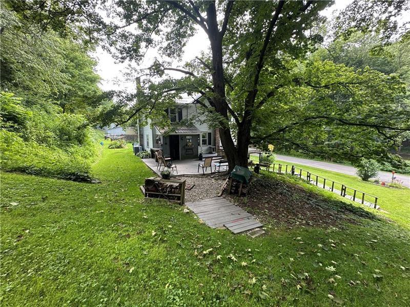 944 Van Gorder Mill Road Ellwood City, PA 16117 - Photo 12 of 48 a view of a park with a bench and trees