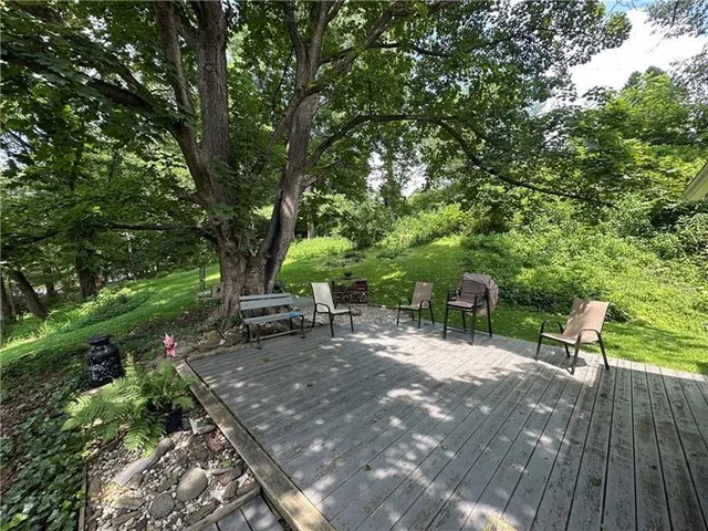 a view of a bench in a backyard