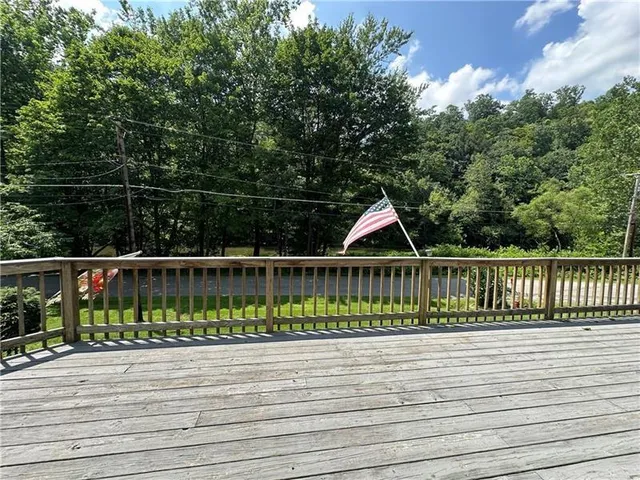 a view of a deck with a wooden fence
