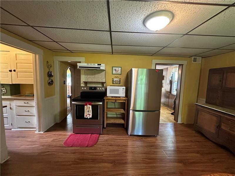 944 Van Gorder Mill Road Ellwood City, PA 16117 - Photo 27 of 48 a kitchen with stainless steel appliances granite countertop a refrigerator and microwave