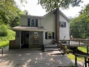 944 Van Gorder Mill Road Ellwood City, PA 16117 - Photo 3 of 48 a view of house with a deck and furniture