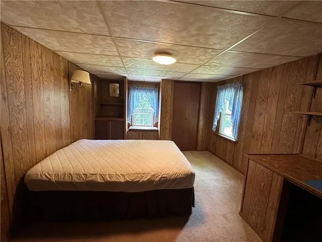 a view of a room with wooden walls