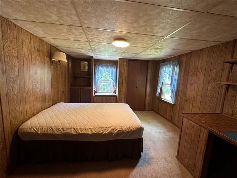 944 Van Gorder Mill Road Ellwood City, PA 16117 - Photo 31 of 48 a bed room with a bed and a window