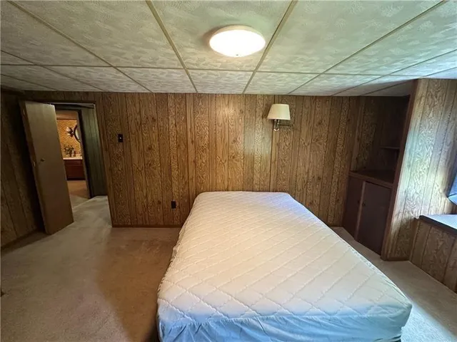 a view of entryway with wooden walls