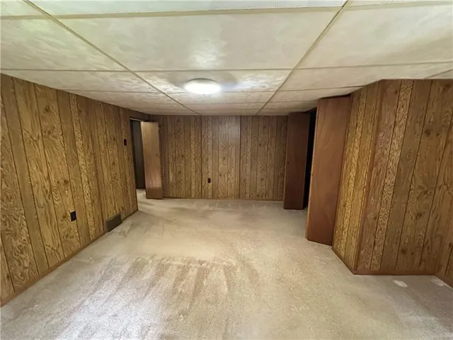 a view of entryway with wooden walls