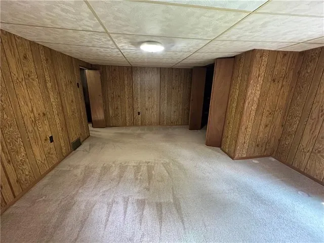 a bathroom with a double vanity sink toilet mirror and shower