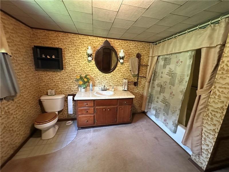 944 Van Gorder Mill Road Ellwood City, PA 16117 - Photo 37 of 48 a bathroom with a double vanity sink toilet mirror and shower