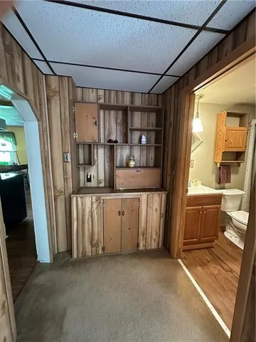 a view of a wooden deck with a yard