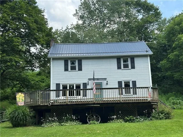 a view of a house with a deck yard and patio