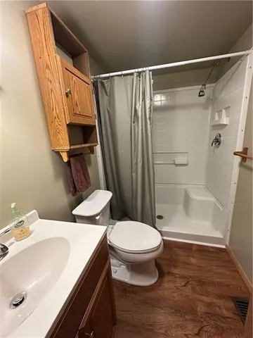 a view of balcony with wooden floor and outdoor seating