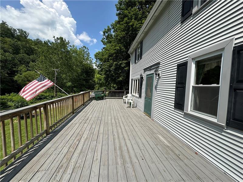 944 Van Gorder Mill Road Ellwood City, PA 16117 - Photo 42 of 48 a view of a wooden deck with a yard