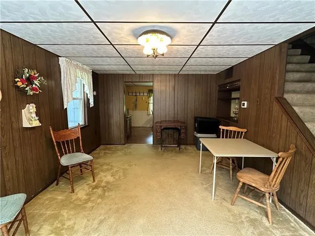 a kitchen with counter top space and wooden floor
