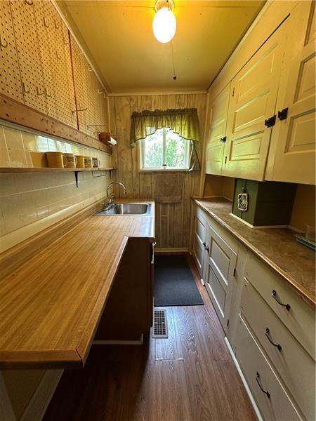 944 Van Gorder Mill Road Ellwood City, PA 16117 - Photo 48 of 48 a kitchen with counter top space and wooden floor