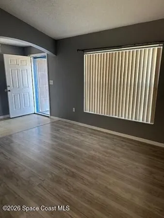 a kitchen with granite countertop a stove and a microwave