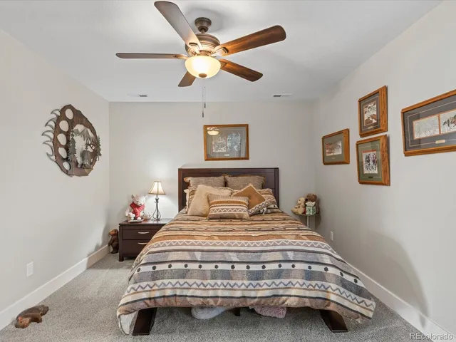a bathroom with a sink a toilet and shower curtain